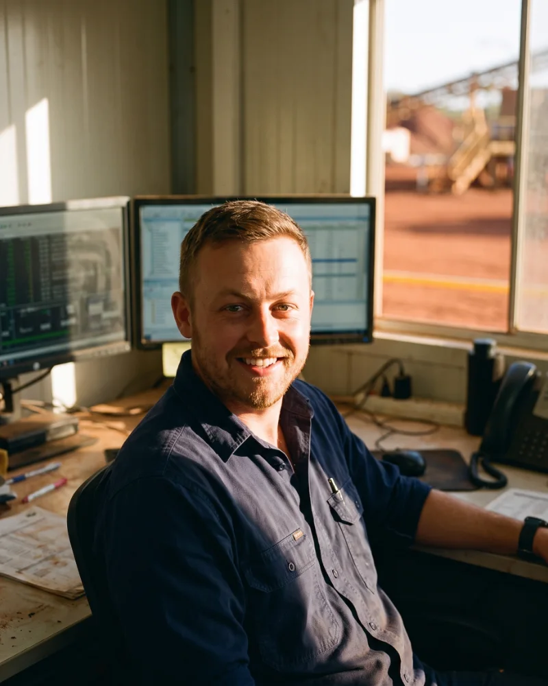 Craig Moult, at a desk in a site office.